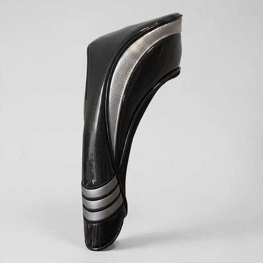 Black and silver headcover in a studio