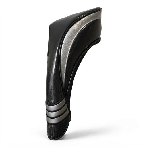 Black and silver head cover on a gray background