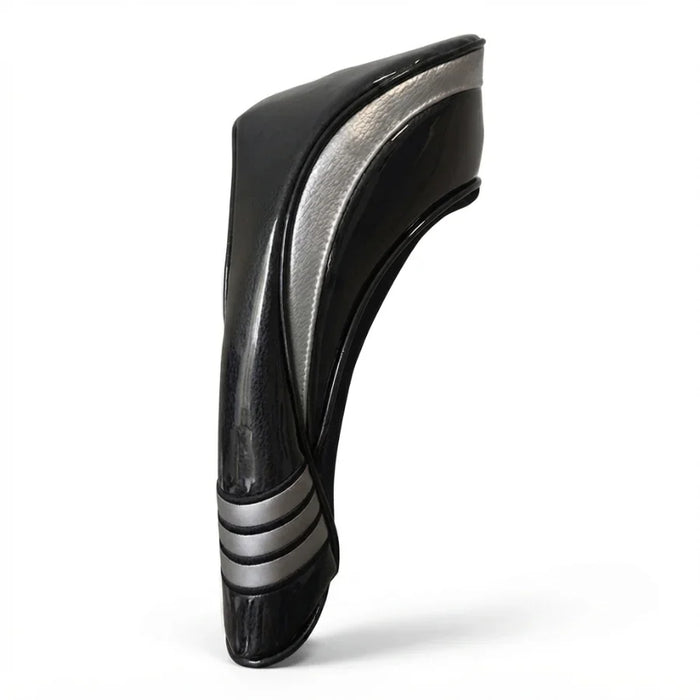 Black and silver head cover on a gray background