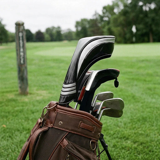 Black and silver headcover in a golf bag on a golf course