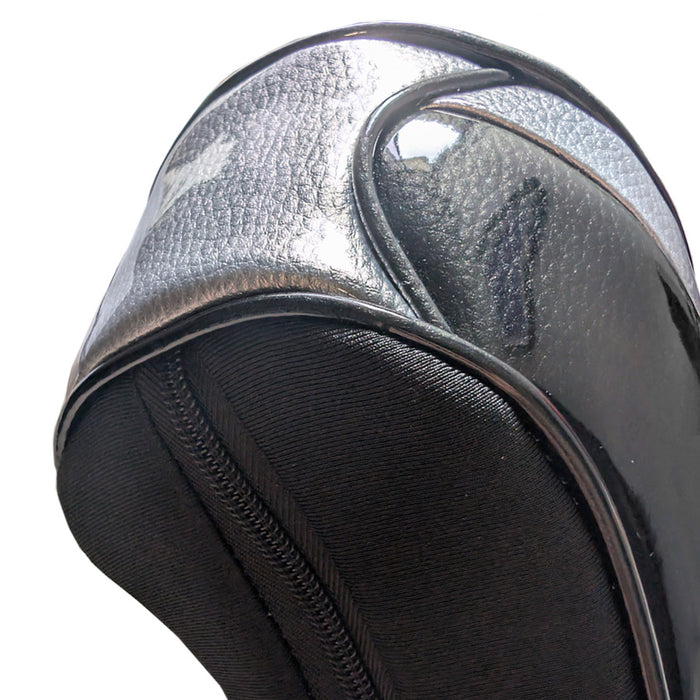 Close-up of a black and silver textured headcover on a white background