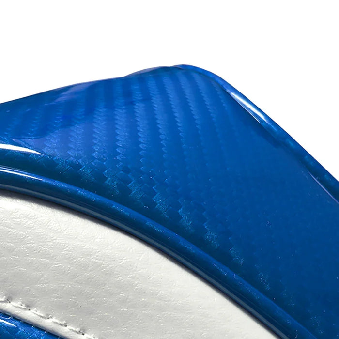 Close-up of a blue and white headcover with a textured carbon surface.