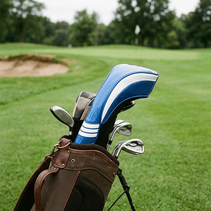 Blue and white golf club head cover with carbon fibre texture in a golf bag on a golf course
