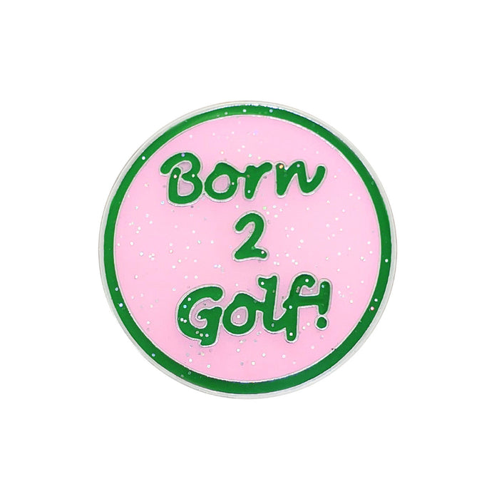 Round pink sticker with green text 'Born 2 Golf!' on a white background