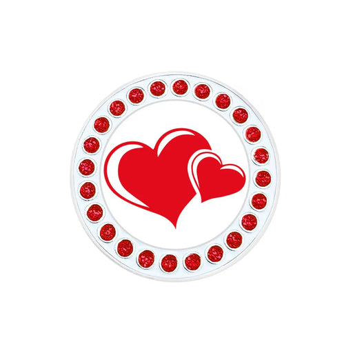 Navika golf marker with red heart design and red embellishments on a white background