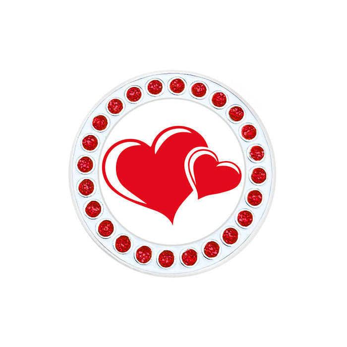 Circular object with red heart design and red embellishments on a white background