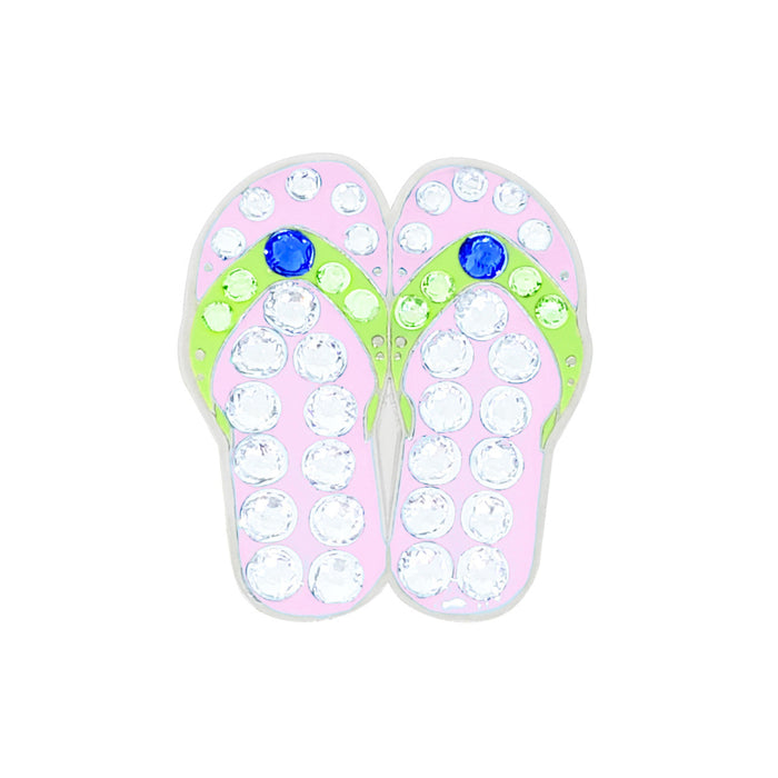 Pink flip-flop Navika golf marker sandals with rhinestones and green soles on a white background