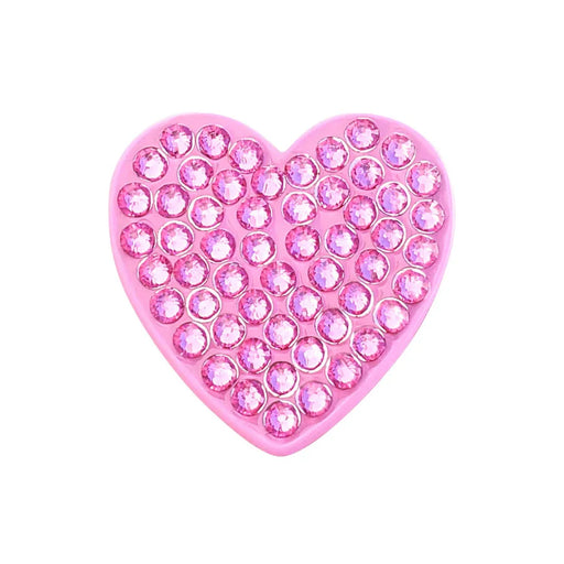 Pink heart-shaped Navika golf marker object with embedded crystals on a white background