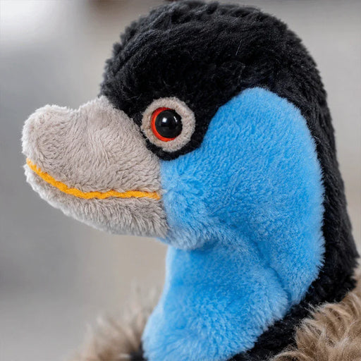 Close-up of a plush fluffy headcover resembling an emu, designed for a golf club on a blurred background
