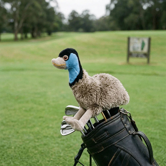 A plush fluffy headcover resembling an emu, designed for a golf club. golf club head cover with a golf course background