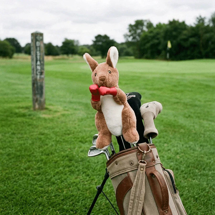 Plush kangaroo golf headcover with a in a golf bag on a grassy field.