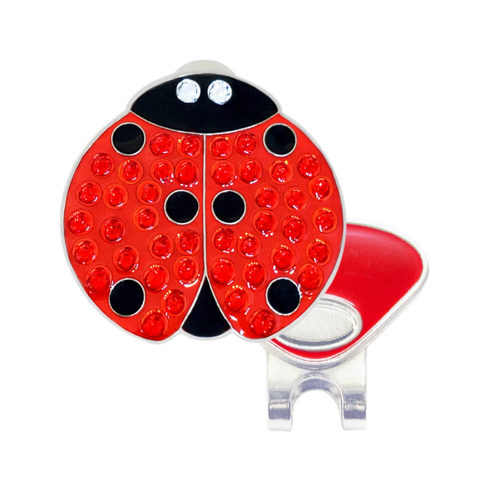 Red ladybug-shaped magnetic hat clip with crystals on a white background