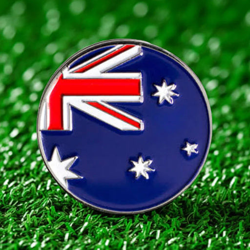 Australian flag badge golf ball marker on a grass background