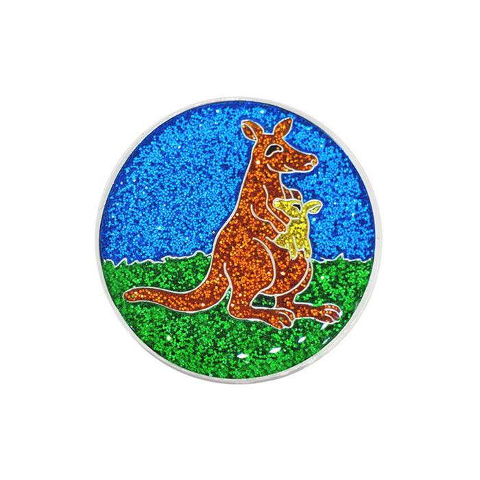 Glittery round object with a kangaroo and baby design on a blue and green background