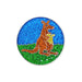 Glittery round object with a kangaroo and baby design on a blue and green background