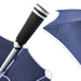 Close-up of a navy tipless umbrella with a textured anti slip grip black handle on a white background. golf umbrella