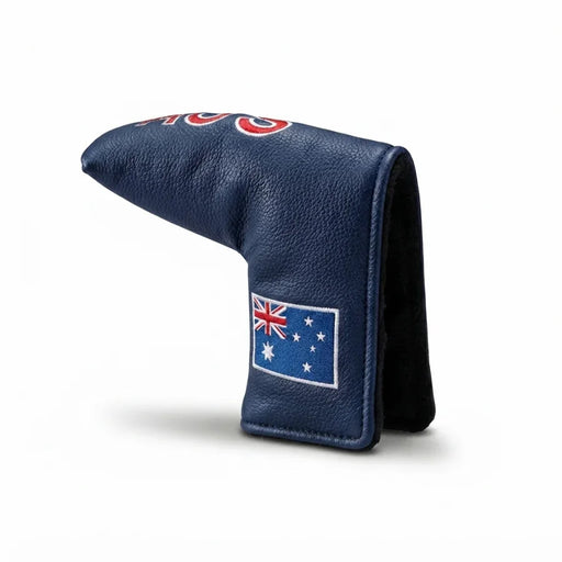 A navy blue textured leather golf club headcover with a red and white logo on top and an embroidered Australian flag patch on the lower front, shown on a light gray background.