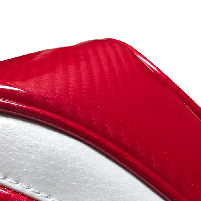 Close-up of a red and white headcover with carbon fiber texture.