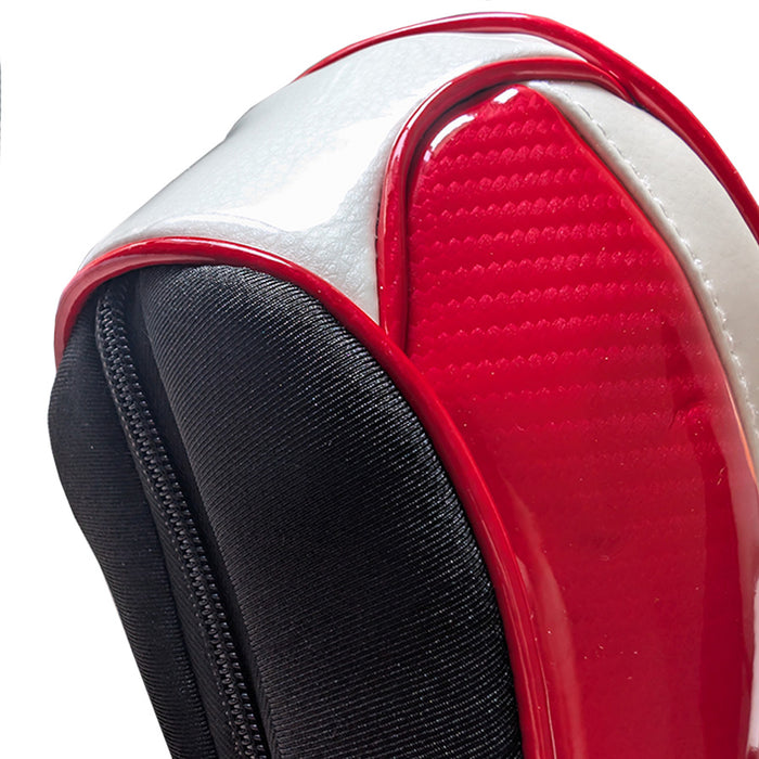 Close-up of a red, white, and black headcover textured 