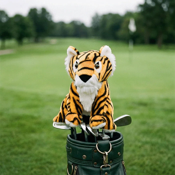 Golf club head cover with a tiger design on a golf course