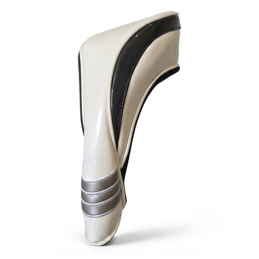 A a glossy off-white headcover, a prominent black side stripe, and three metallic silver bands near the base, set against a plain white background.