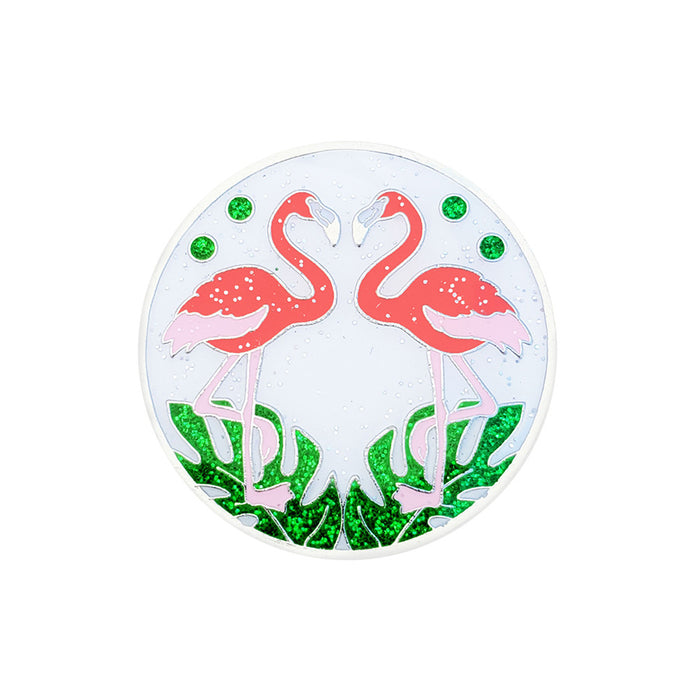 Circular decorative item with pink flamingo design on a white background