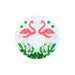 Circular decorative item with pink flamingo design on a white background