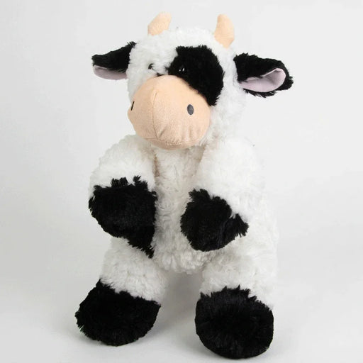 A plush golf club head cover in the shape of a cow with a black and white coat, resembling a headcover for a golf club.