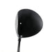 A close-up studio shot of a black golf driver head and part of its shaft against a plain white background.
