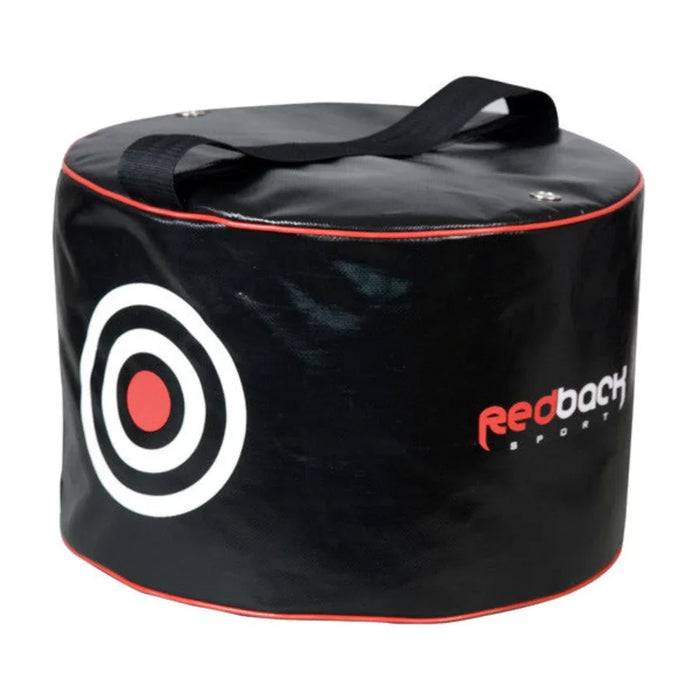 A black golf impact bag with a red target design and the Redback brand logo, featuring handles and red trim.